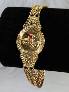 Elegant Goldtone Religious Bracelet with Red Accent